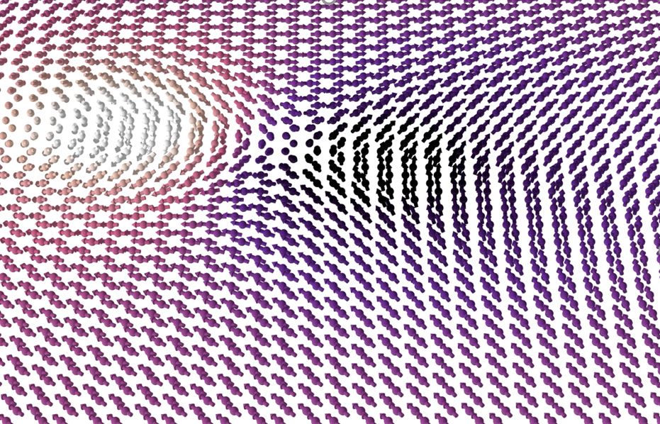 Simulation snapshot of the collision of a vortex and an antivortex spin-textures in 2D CrCl3 magnetic at low temperature. The orientation of the spins follows a colour pattern where white (black) means completely down (up) spin orientation. CrCl3 is an easy-plane compound with all spins aligned along the plane, except at the core of the merons and antimerons.