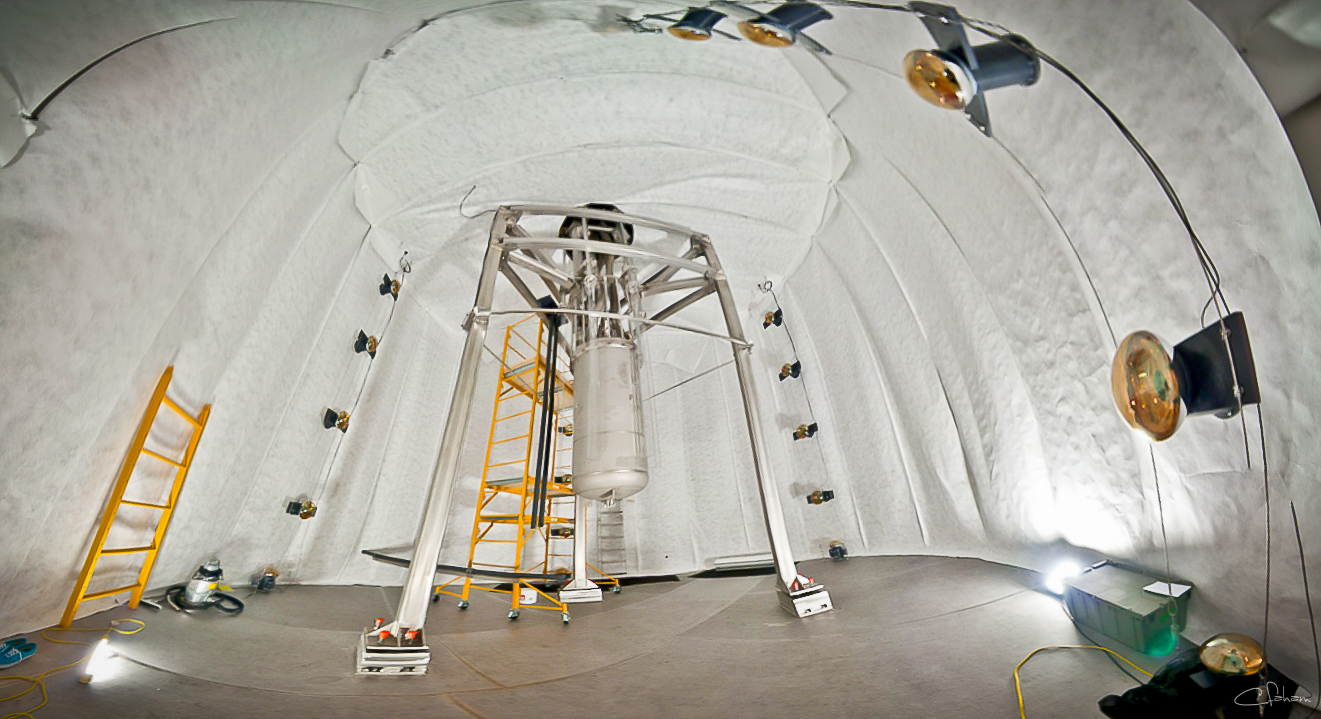 LUX, underground and in the tank. The tank has been filled with water to remove neutrons and external radioactivity byproducts. 20 large photomultipliers act as a veto in the water tank. (Photo by C.H. Faham.)