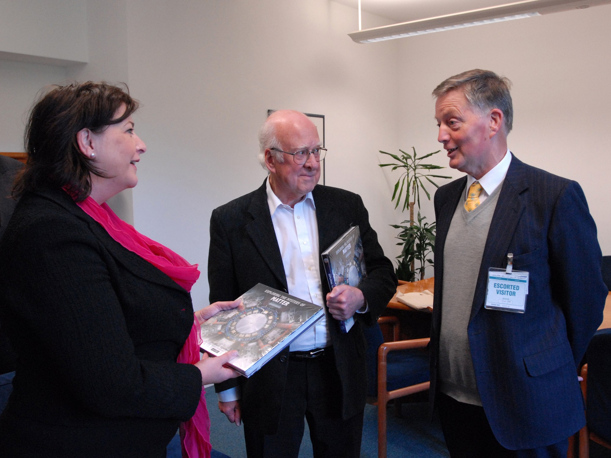 From left to right: Fiona Hyslop, Peter Higgs and Ken Smith. Ken Smith has just presented copies of &#039;Exploring the Mystery of Matter&#039; to Peter and Fiona.