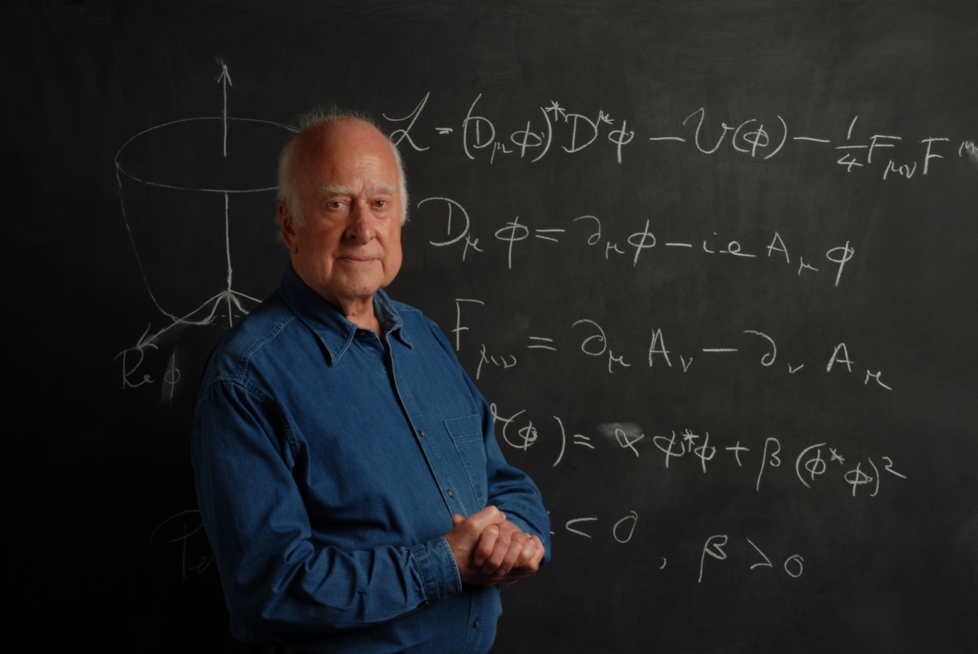 Photographic portrait of Peter Higgs, in front of blackboard, taken by Peter Tuffy. 17 June 2009.