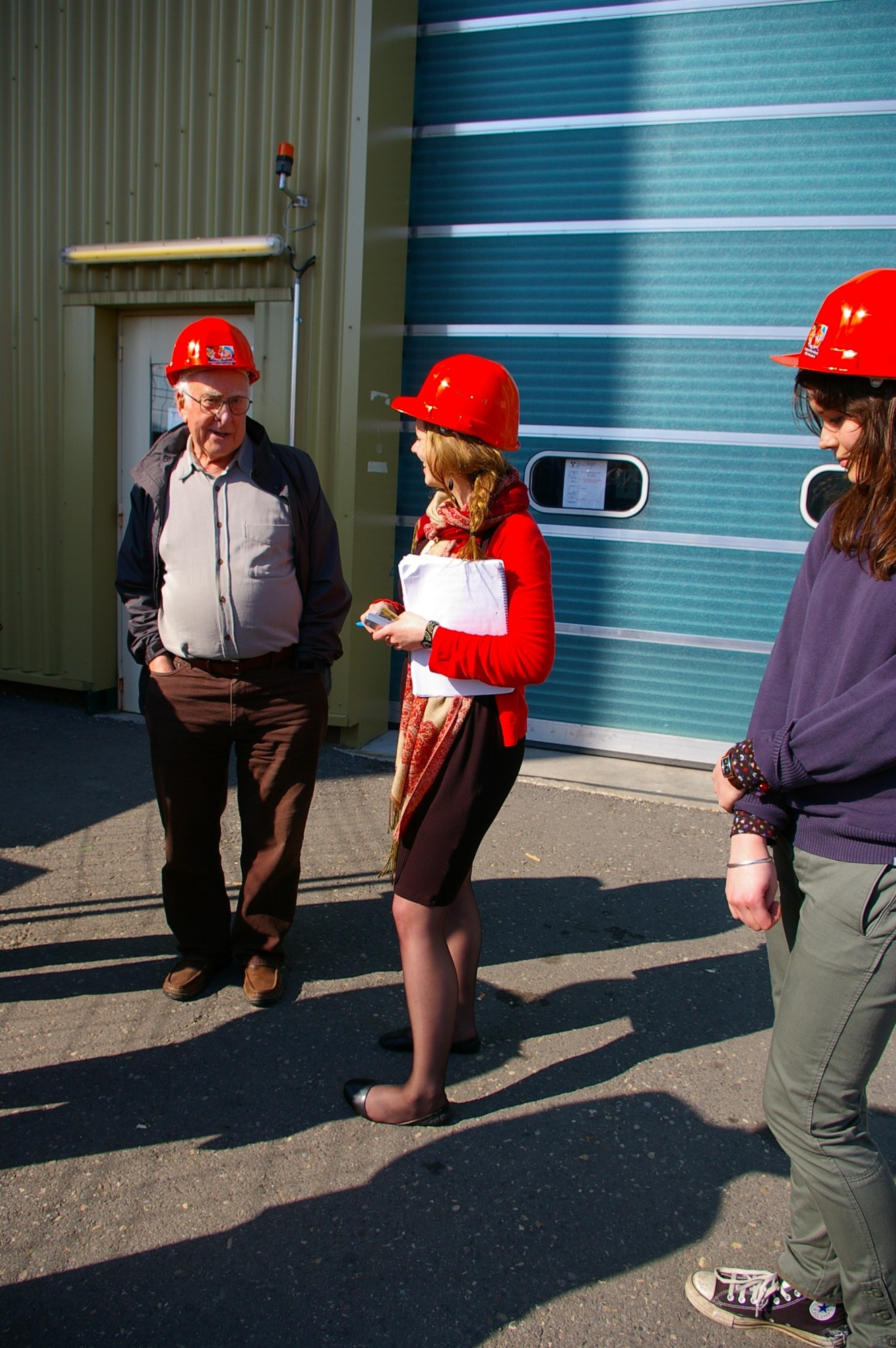 Peter Higgs, Elizabeth Gibney of the CMS collaboration and Jessica Griggs talking after the visit to the CMS construction hall and underground experiment hall. Photograph copyright Alan Walker, University of Edinburgh.