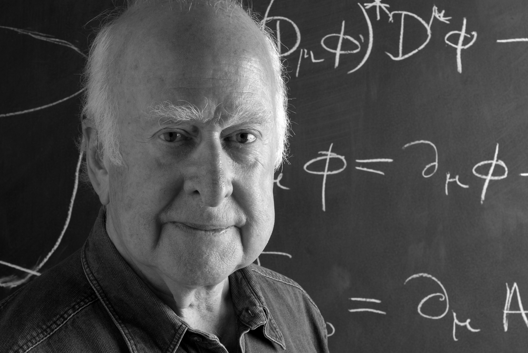 B&amp;W close-up photographic portrait of Peter Higgs, in front of blackboard, taken by Peter Tuffy. 17 June 2009.