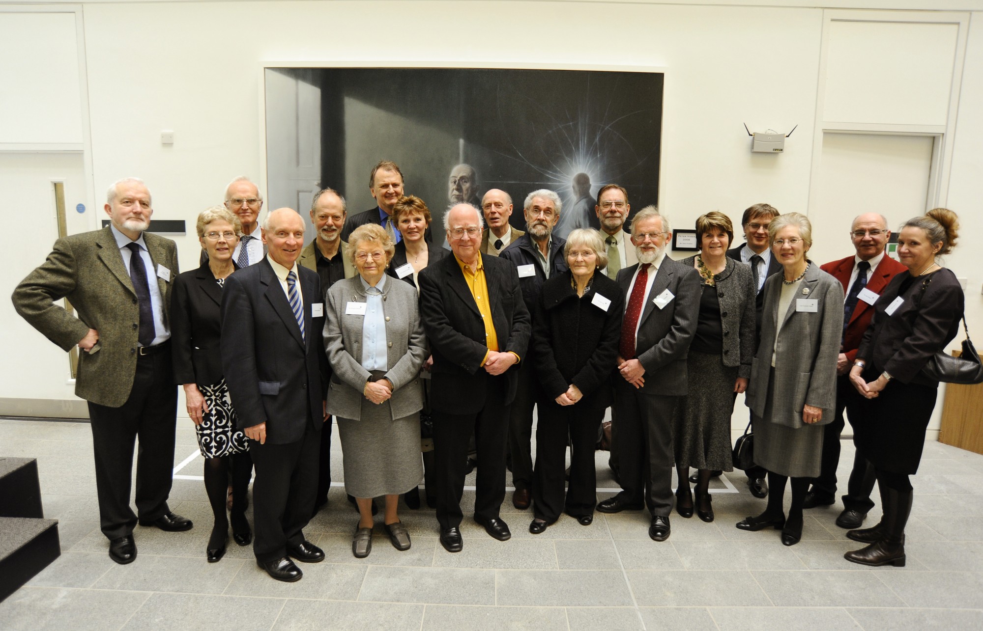 Peter Higgs pictured with former members of the Taiit Institute of Mathematical Physics and their partners.