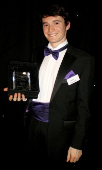 Robert Concannon with his award for Best Postgraduate Who Tutors 